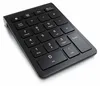 A black numeric keypad is shown from a diagonal angle against a white background. Náhled obrázku produktu