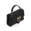 A black handbag with gold hardware is shown against a white background. Voir les images du produit