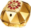 A close-up, studio shot of a gold-colored perfume bottle. Voir les images du produit