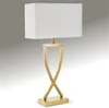 A modern gold table lamp with a white rectangular shade, set against a gradient gray background. Produktbild-Vorschau