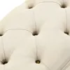 A close-up view of the tufted fabric of an ottoman or bench. Podgląd zdjęcia produktu
