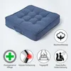 A dark blue seat cushion is shown on a light gray background, with several icons and text describing its features. Náhled obrázku produktu