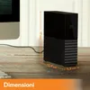 A black external hard drive is shown on a wooden desk next to a computer monitor. Dimensions are indicated with orange lines and text. Produktbild-Vorschau