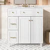 A white bathroom vanity with a marble countertop and gold hardware, set against a tiled wall and floor. Anteprima dell’immagine prodotto