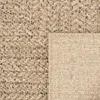 Close-up view of a woven rug with a textured pattern. Náhled obrázku produktu
