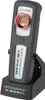 A Scangrip CCT SCAN LED work light is shown in its charging dock. Podgląd zdjęcia produktu