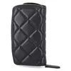 A black quilted wallet is shown against a white background. Produktbild-Vorschau