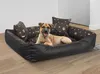 A dog is lying comfortably in a dog bed with a bone and paw print pattern. Anteprima dell’immagine prodotto