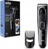 The image shows the packaging and the product of a Braun hair clipper, along with an accessory. Náhľad obrázku produktu