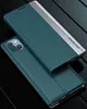 A teal iPhone 13 case with a silver accent strip is shown from a diagonal angle on a black reflective surface. Produktbild-Vorschau