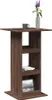 A tall, narrow bar table with shelves, decorated with a vase of flowers and a coffee cup. Voir les images du produit