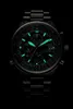 A close-up shot of a men's watch against a black background. Produktbild-Vorschau