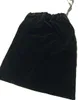 A black velvet drawstring bag shown against a white background. Voir les images du produit