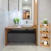 A modern bathroom vanity with a sink and a wooden corner shelf unit. Podgląd zdjęcia produktu
