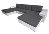 A large sectional sofa in a U-shape, with dark gray cushions and white base and armrests, shown against a white background. Náhled obrázku produktu