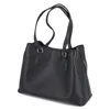 A black tote bag is shown from a side angle against a white background. Produktbild-Vorschau