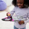 A young girl is playing with a toy jet. Náhľad obrázku produktu