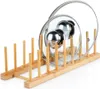 A bamboo pot lid organizer with two pot lids on it, set against a white background. Produktbild-Vorschau