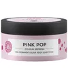 A product shot of a hair mask in a pink tub with a black lid. Anteprima dell’immagine prodotto