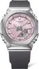 A close-up studio shot of a pink G-Shock watch with a silver bezel and a gray band. Produktbild-Vorschau