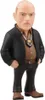 A figurine of a bald man in a suit and tie, with a badge around his neck. Podgląd zdjęcia produktu