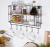 A kitchen shelf with spices, olive oil, and glasses hanging from hooks. Anteprima dell’immagine prodotto