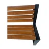 A close-up view of a wooden bench with black metal legs. Voir les images du produit