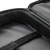 A close-up view of the interior of a black notebook bag, showing the padded edge and a fabric strap. Podgląd zdjęcia produktu