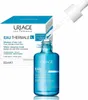 A product shot of a Uriage Eau Thermale Serum H.A Booster Serum bottle and its packaging, with a dropper poised above the bottle. Anteprima dell’immagine prodotto