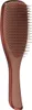 A close-up studio shot of a bronze-colored hairbrush against a white background. Anteprima dell’immagine prodotto
