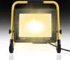 A bright LED work light with a yellow stand. Produktbild-Vorschau