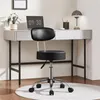 A black adjustable stool is placed in front of a modern white desk with a laptop, a plant, and a lamp. Produktbild-Vorschau
