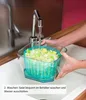 Washing salad in a salad spinner in a kitchen sink. Produktbild-Vorschau