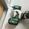 A person wearing gloves is using a cordless impact driver to screw into a metal stud. Voir les images du produit