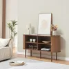 A living room scene with a sideboard, sofa, and plant. Náhled obrázku produktu