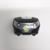 A close-up, top-down view of a black and silver LED headlamp against a white background. Produktbild-Vorschau
