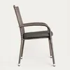 A side view of a single brown wicker chair with a dark gray cushion against a white background. Podgląd zdjęcia produktu