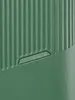 A close-up view of a green suitcase with a textured surface and the brand logo embossed on it. Produktbild-Vorschau