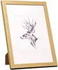 A gold-colored picture frame with a black and white drawing of a deer inside, displayed on a white background. Produktbild-Vorschau