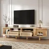 A modern TV stand with a television and decorative items in a living room setting. Anteprima dell’immagine prodotto