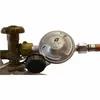 A close-up view of a gas regulator attached to a gas cylinder valve. Produktbild-Vorschau