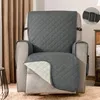 A gray quilted slipcover is placed on a recliner chair. Anteprima dell’immagine prodotto