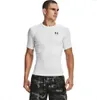 A man wearing a white t-shirt and camouflage shorts, posing for a product shot. Produktbild-Vorschau