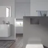 A modern bathroom with a vanity, mirror, and a flush plate for a toilet. Anteprima dell’immagine prodotto