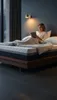 A woman is reading a book in bed on a mattress. Produktbild-Vorschau