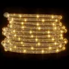 A coiled rope light with warm white LEDs on a black background. Produktbild-Vorschau