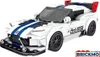 A white and blue toy car model with racing stripes and a spoiler, displayed on a white background. Anteprima dell’immagine prodotto