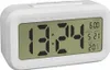 A white digital alarm clock displaying the time, date, alarm setting, and temperature. Náhled obrázku produktu