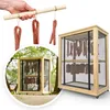 A collage showing a hand holding sausages on a wooden stick and a drying cabinet with sausages inside. Produktbild-Vorschau