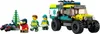 A LEGO City all-terrain ambulance with two paramedics carrying a stretcher, a patient in a red jacket, and a small green tree. Produktbild-Vorschau